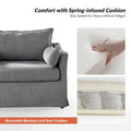 Sophie Contemporary Oversized Slipcovered Armchair and Ottoman with Lockable Rear Wheels